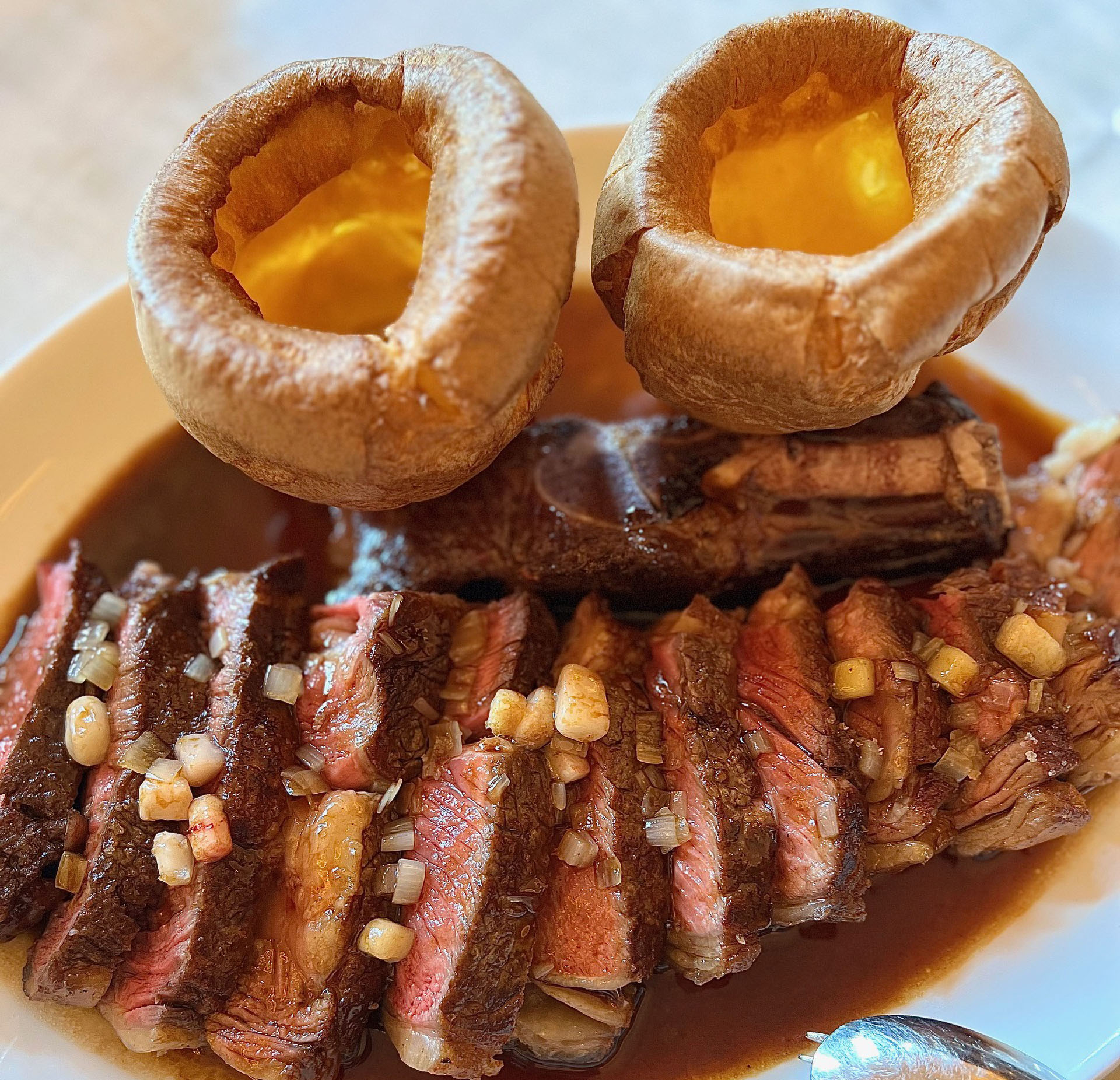 Rib of Grass Fed Beef with Bordelaise Sauce and Horseradish Cream, Yorkshire Puddings